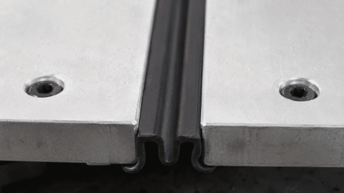 Black molded rubber component for panel protection