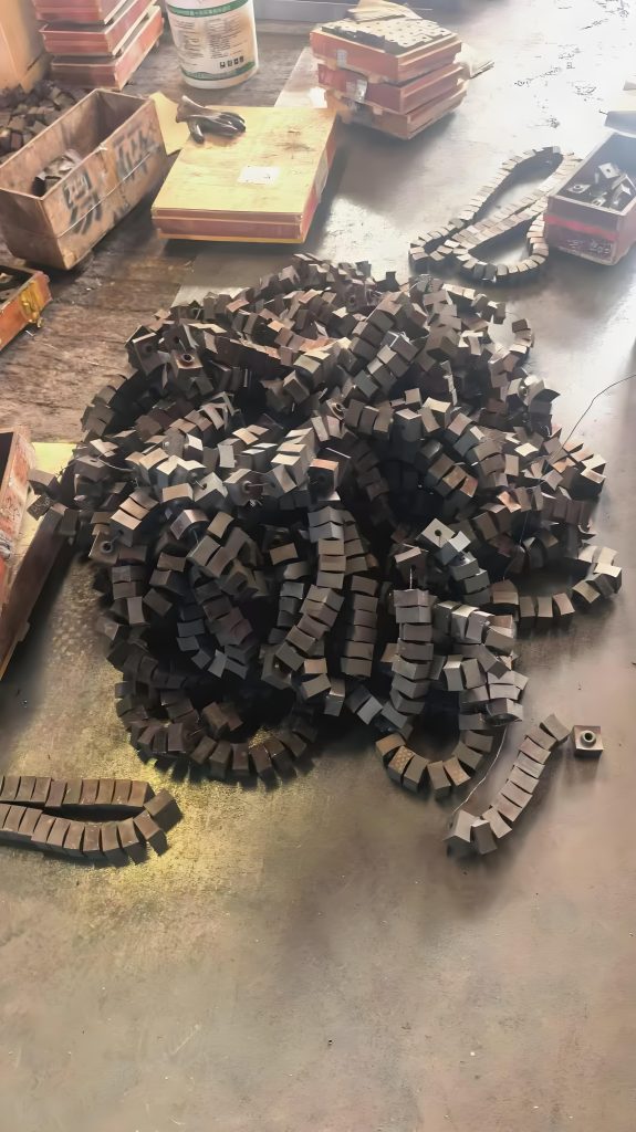 Forged and heat-treated shredder knives on workbench